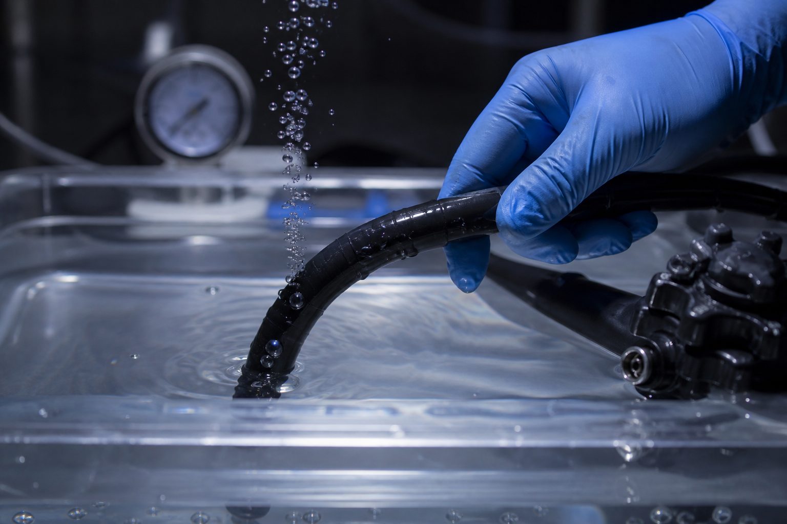 Bubbles rising from a breached flexible endoscope sheath during an underwater leak test